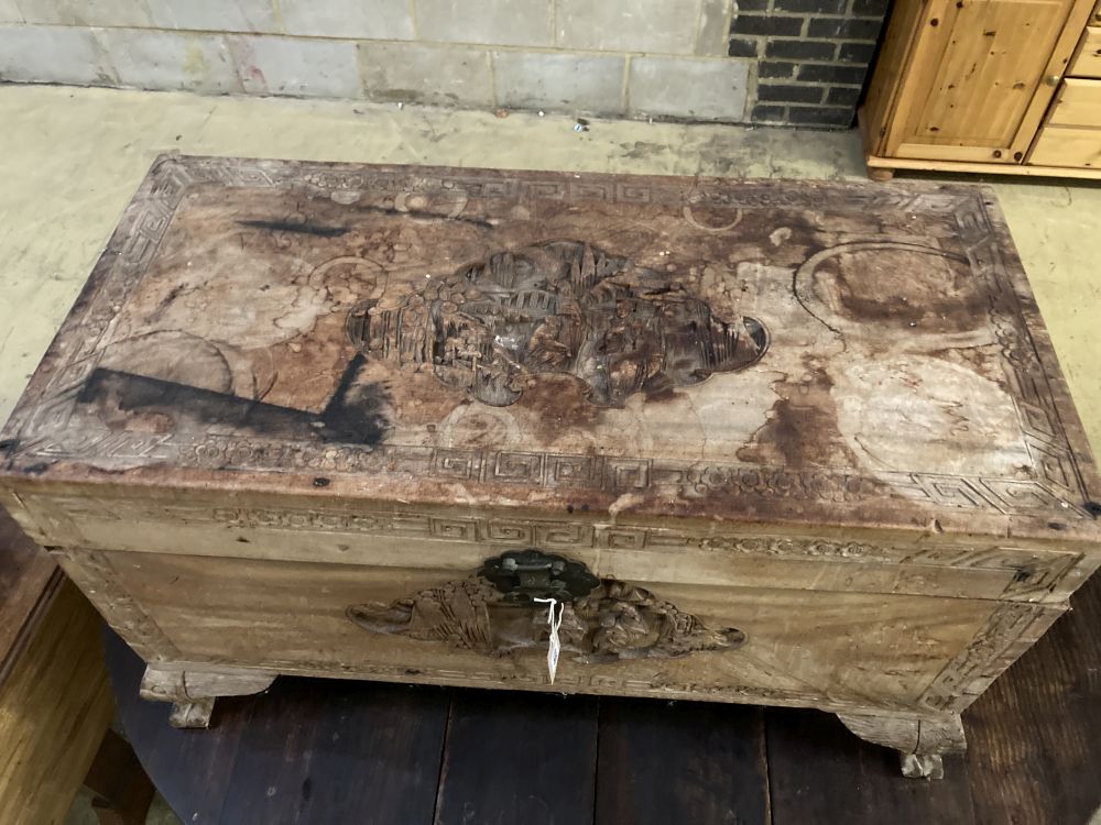 A Chinese carved camphorwood trunk, width 92cm depth 48cm height 51cm